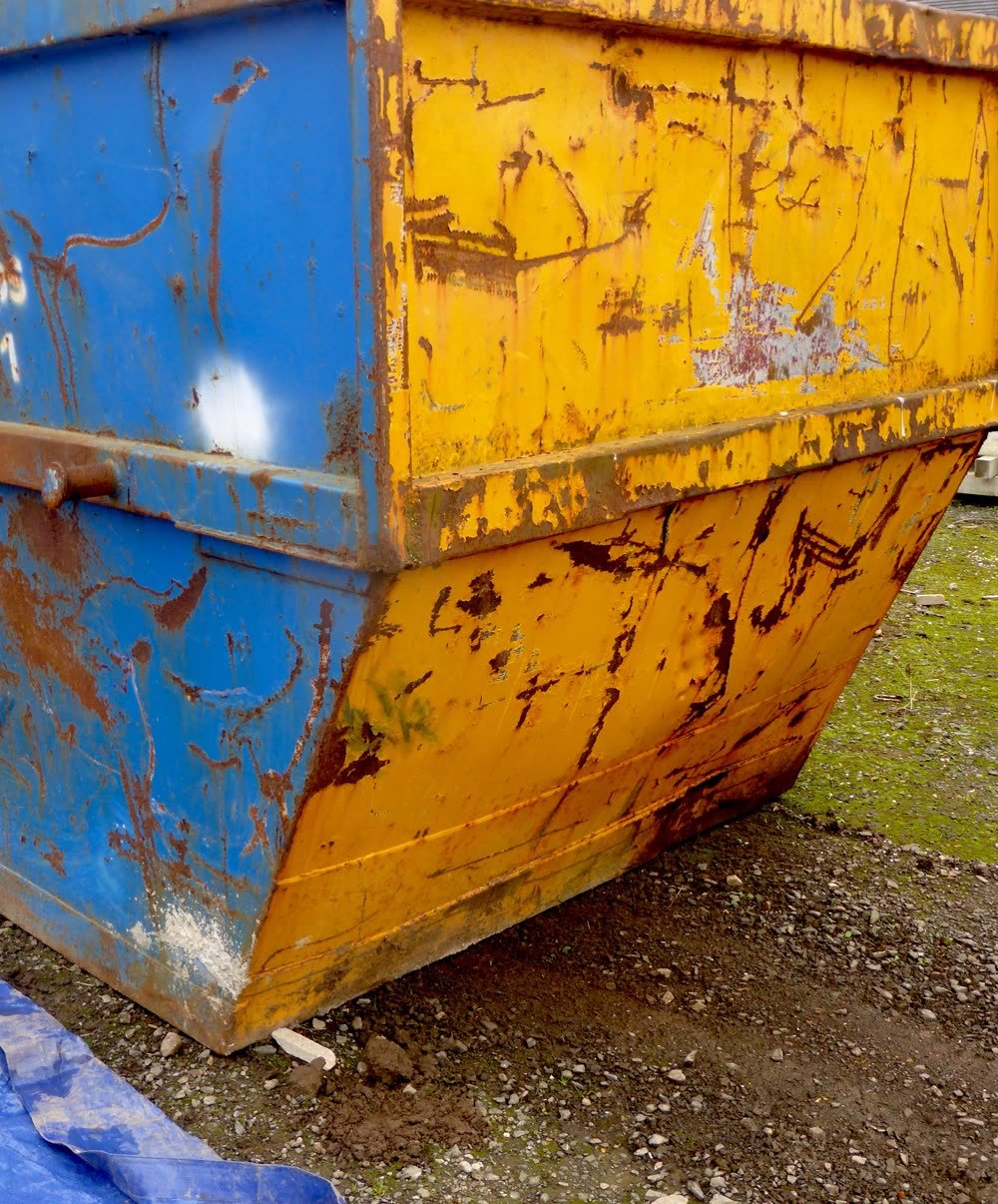 A skip on a residential driveway